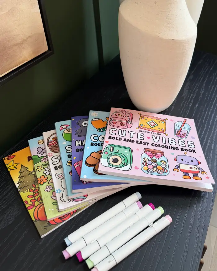 Coloring book for stress relief with markers and creative supplies for mindful relaxation