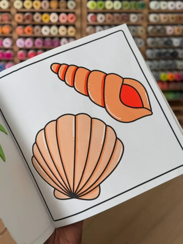 Smoothly blended seashell coloring page demonstrating beginner coloring techniques with alcohol markers.