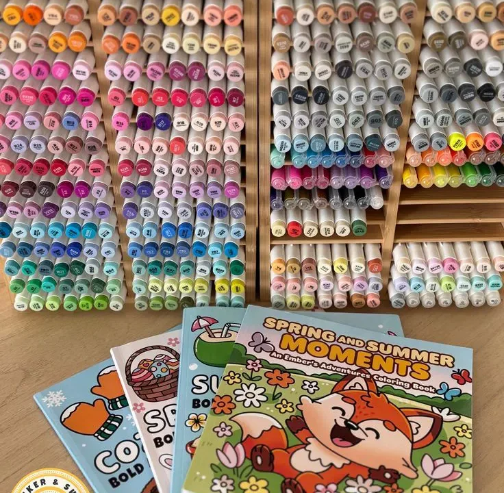 Sticker & Shade adult coloring books displayed with a colorful marker collection for beginner coloring inspiration.