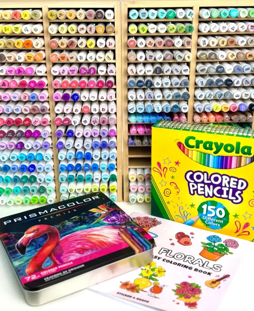 Alcohol markers, colored pencils, and gel pens for beginners learning how to color in adult coloring books.